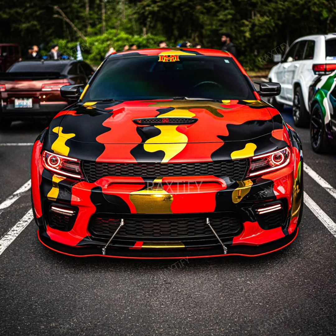 Car with a colorful camouflage design on a street
