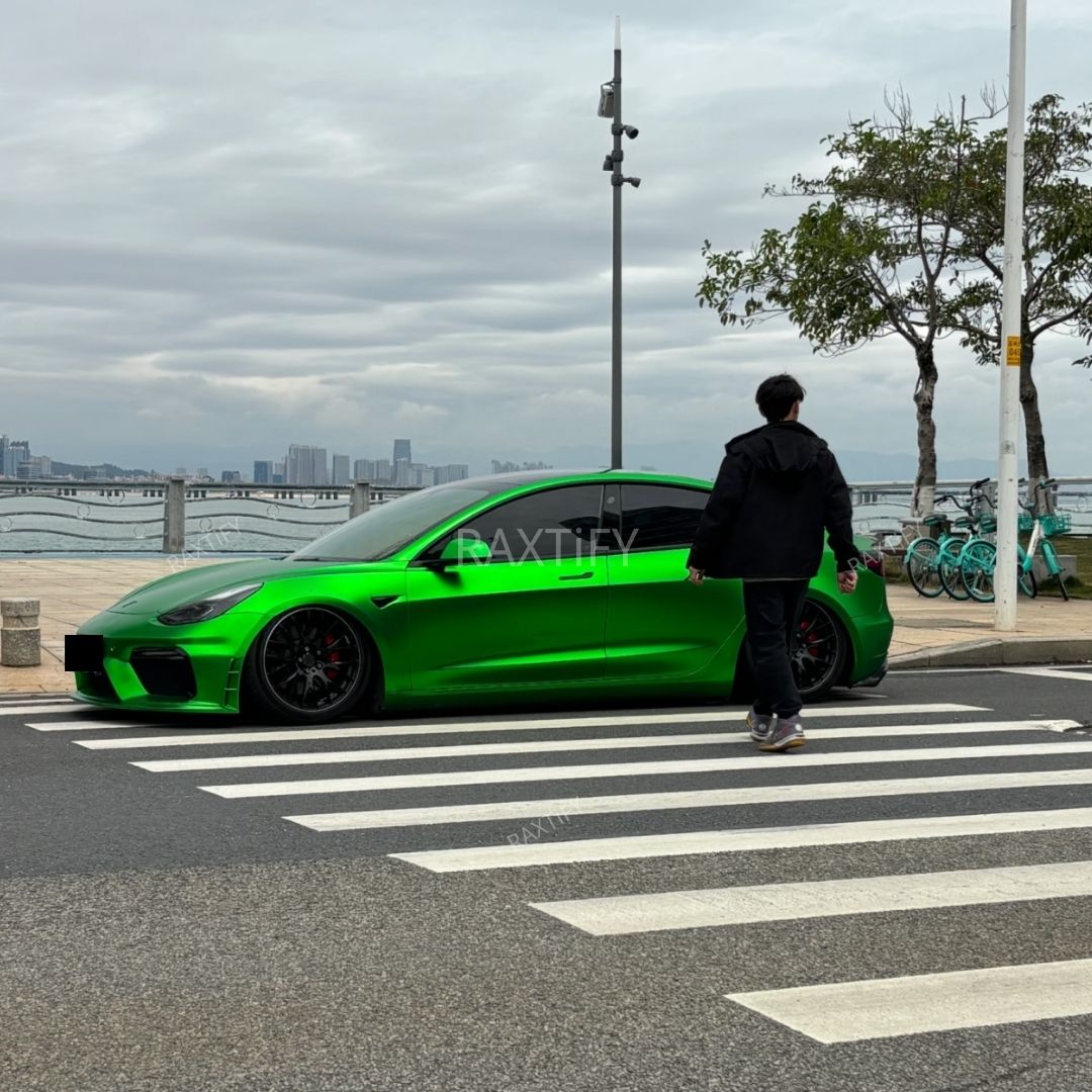 Tesla in Matte Chrome Flame Green Vinyl Wrap parked